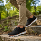 Black UrbanFlex walking shoes worn outdoors